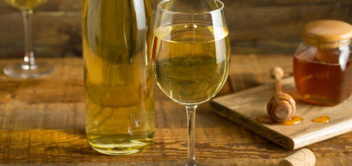 honey wine glass and bottle