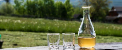 mead bottle over looking field