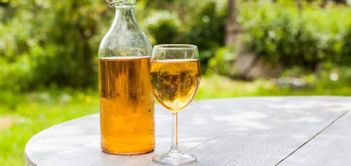 mead in wine bottle and glass